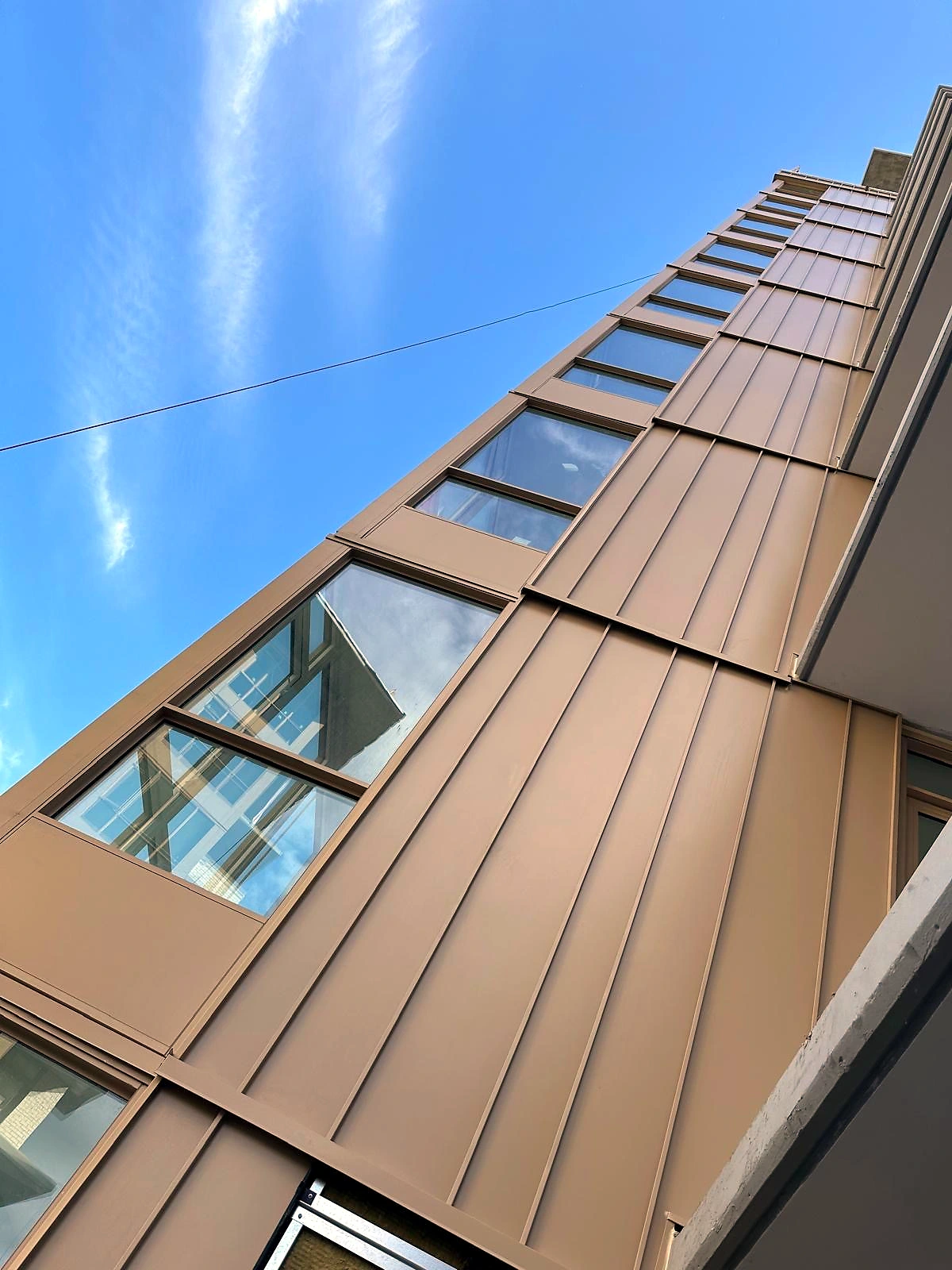 Grey panel wrap at a building corner