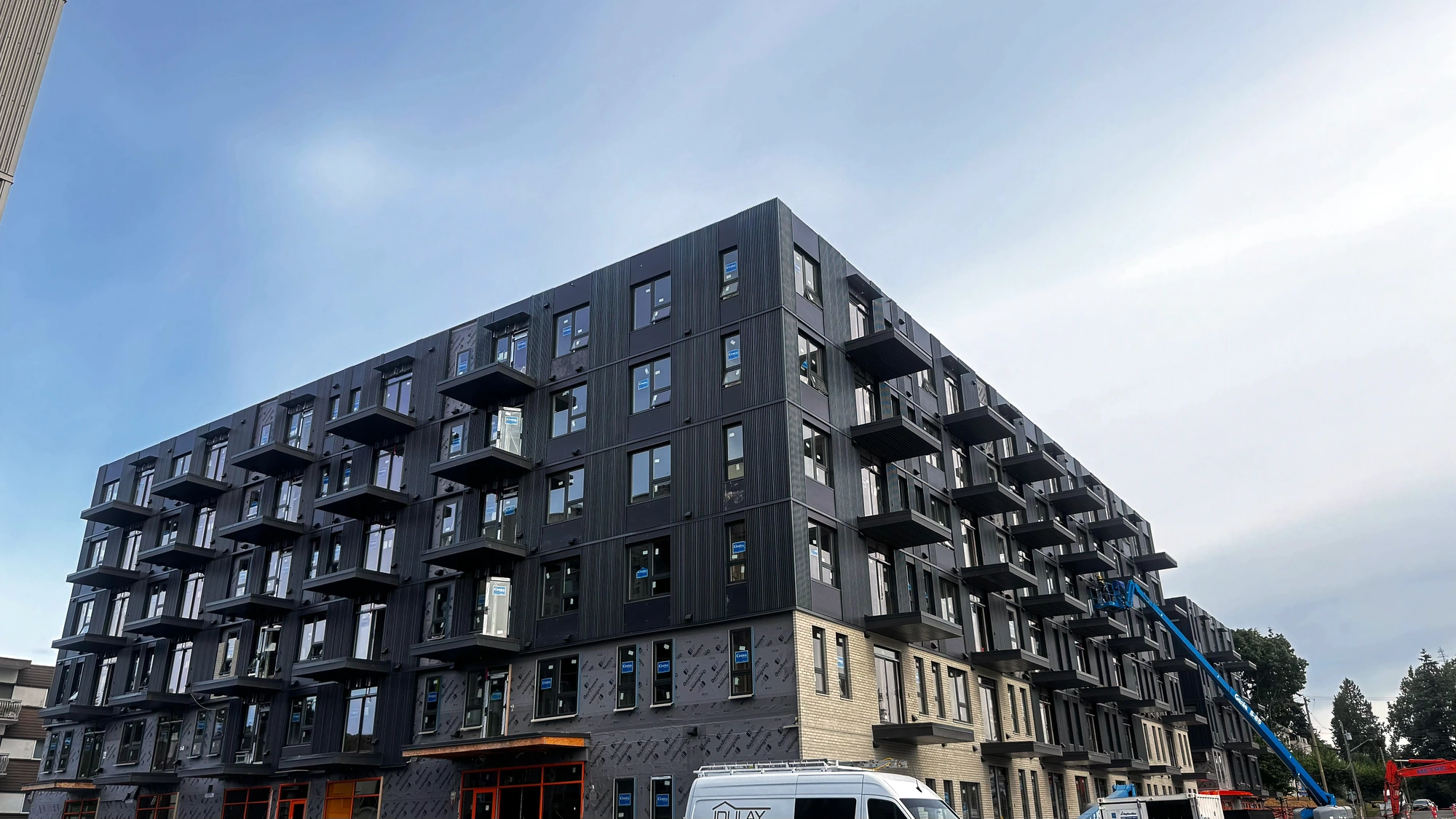 Mixed-material elevation, wood-frame mid-rise